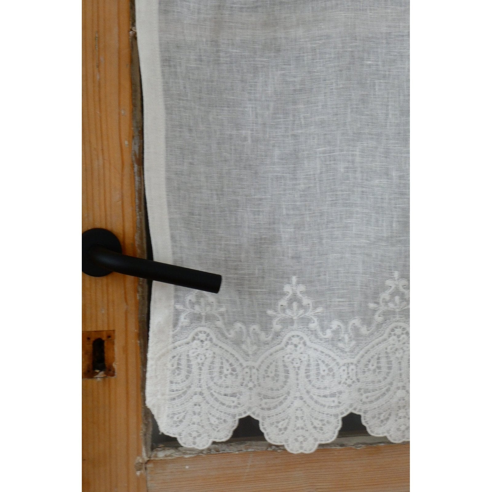 Off-white linen short curtain with delicate embroidery and a scalloped hem.