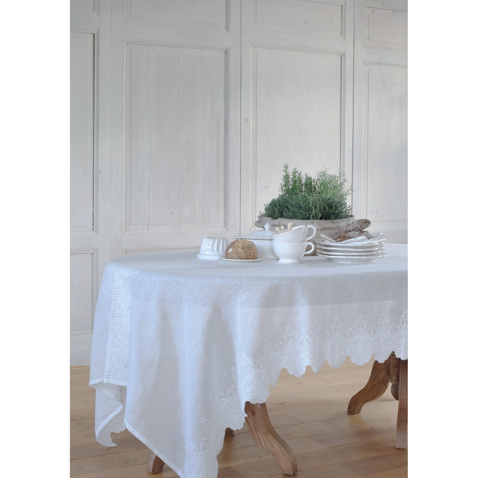 Julia tablecloth is made of 100% linen with a large embroidery in the middle and 2 large embroidered scalloped borders along the length. The simplicity of the linen and the luxury of the embroidery give this tablecloth its well-deserved stunning looks!