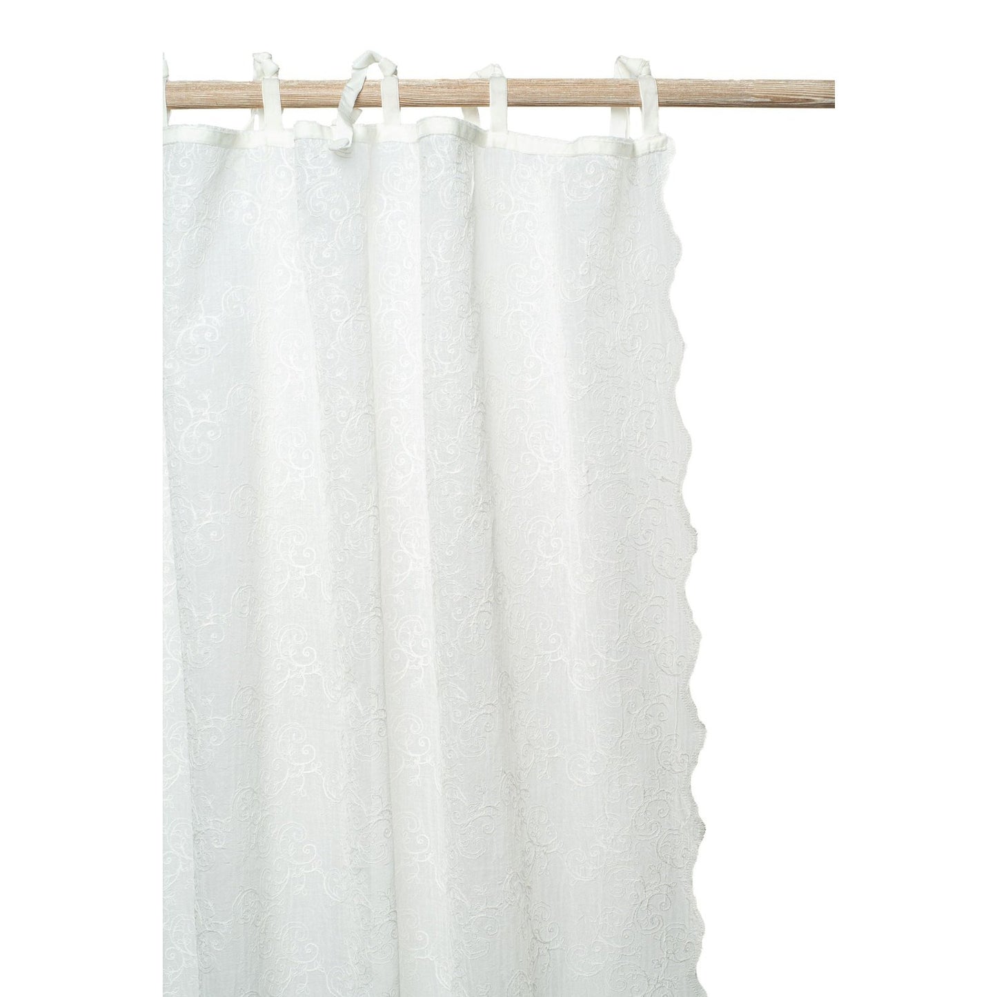 The Camille embroidered voile curtain adds that special touch to your window. Its design is both timeless as well as contemporary and will fit in any interior. Finished with velvet ribbons and a lovely scallop on both lengths.