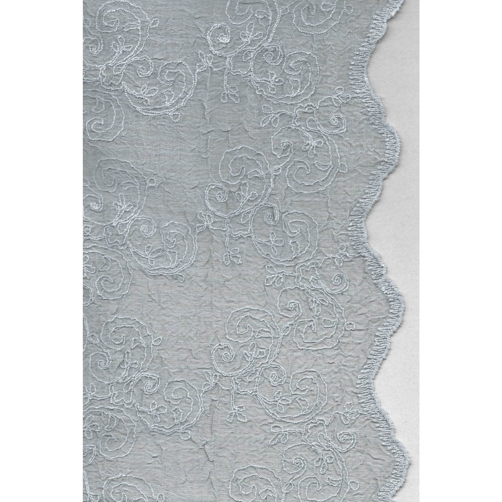 Hampton-blue-voile-curtain-with-soft-embroidery-creates-a-romantic-bedroom-ambiance.