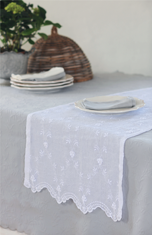 WhiteThis elegant embroidered voile table runner is a perfect fit for any style setting from boho, design to romantic...your table will look fabulous. Dressing your table is a pleasure!
