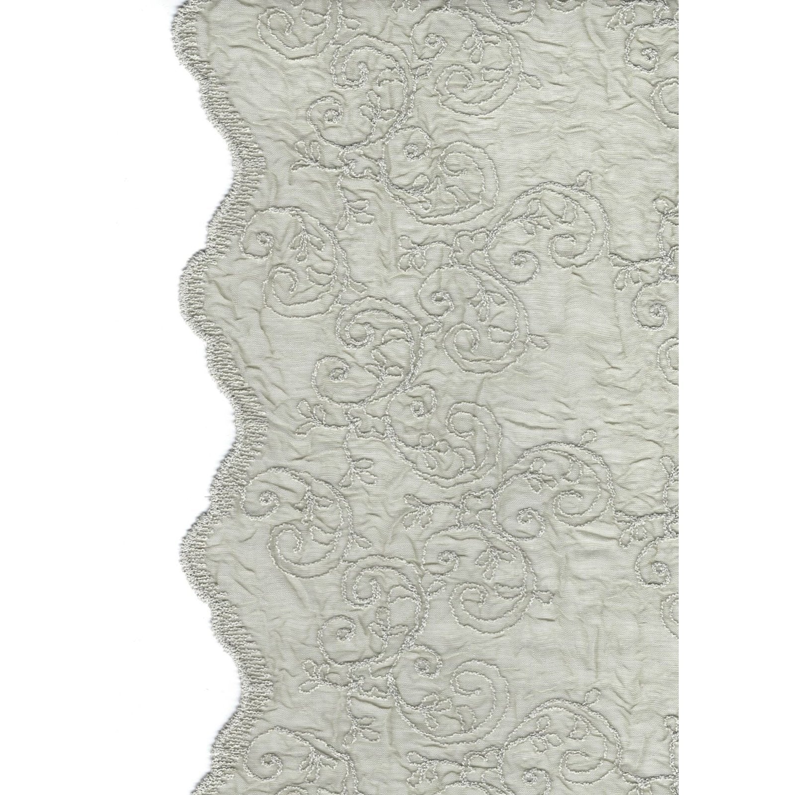 Pebbled-grey-embroidered-voile-curtain-adds-a-touch-of-sophistication-to-a-living-room.