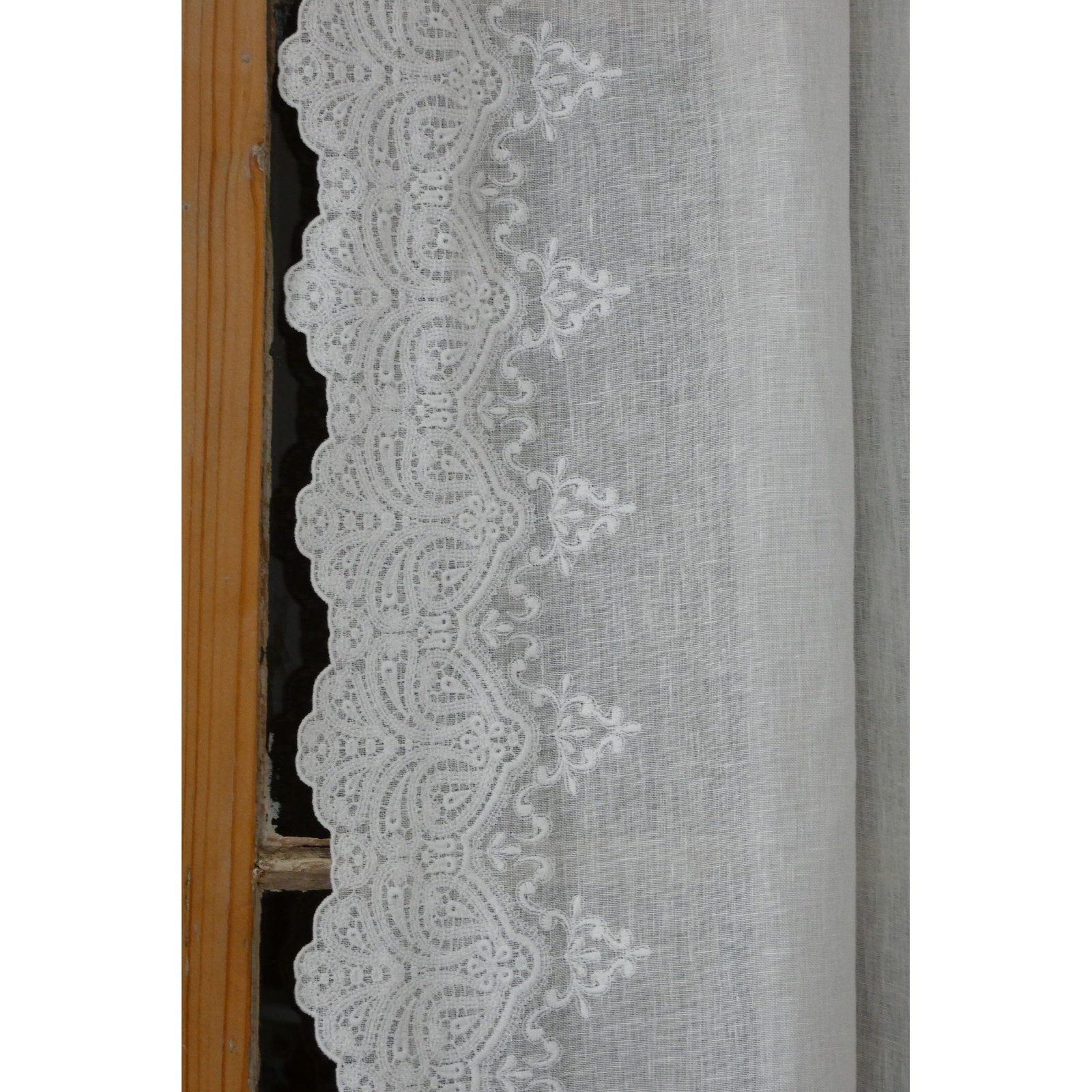 Off-white linen panel with intricate embroidered scallops along both sides.